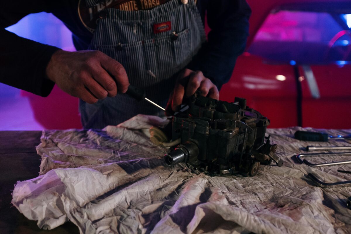 man working on a small engine