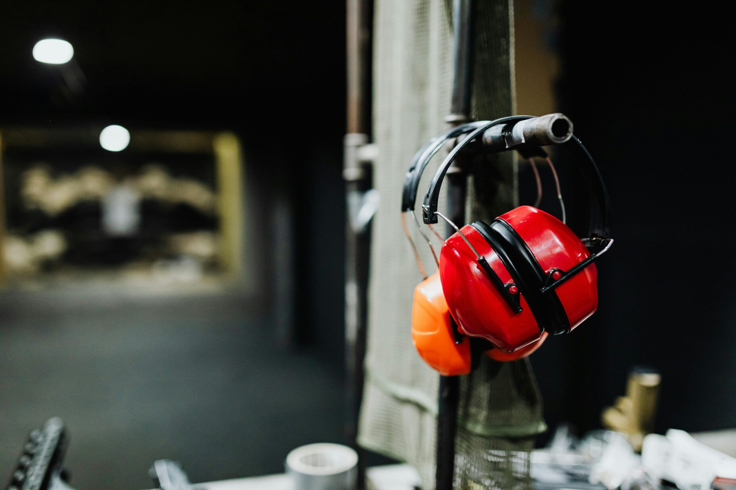 red and orange ear protection hung up