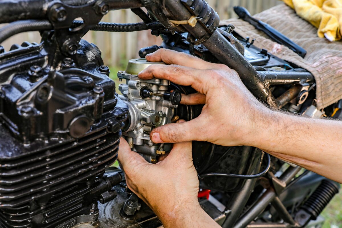man repairing an engine